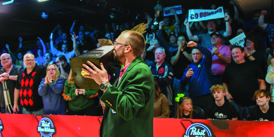 EJ Tackett kisses the U.S. Open trophy